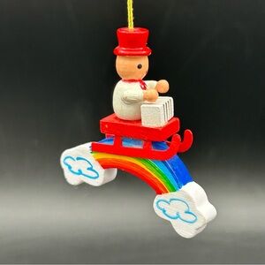 Vintage Ornament Man on Sled Over Rainbow Clouds Pride Hand Painted USA 2.5”